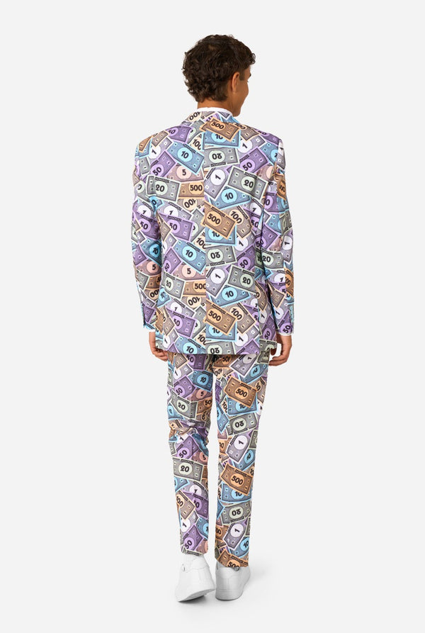 Image of a man wearing a men's suit with an all over print from Monopoly money. He is also wearing a white men's shirt. View from the back.