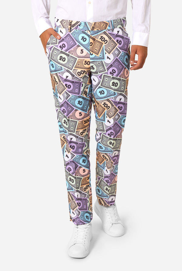 Image of a man wearing a men's suit with an all over print from Monopoly money. He is also wearing a white men's shirt. Pants view.