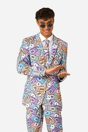 Image of a man wearing a men's suit with an all over print from Monopoly money. He is also wearing a white men's shirt and sunglasses.