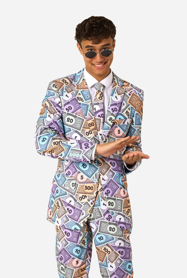 Image of a man wearing a men's suit with an all over print from Monopoly money. He is also wearing a white men's shirt and sunglasses.