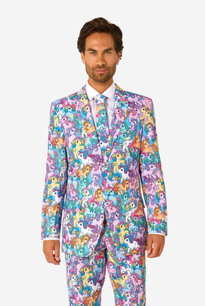 Man wearing a colorful My Little Pony suit with My Little Pony character pattern on a light background.