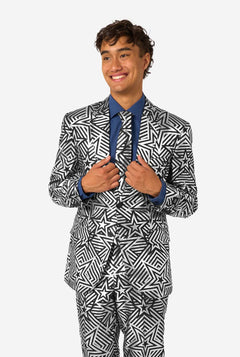 Man wearing a black and white star patterned suit on a white background
