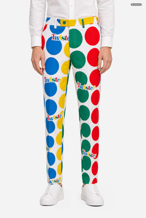 A man wearing a white suit with large multicolored polka dots and the Twister logo, resembling a Twister mat, against a light gray studio background. Pants close-up.