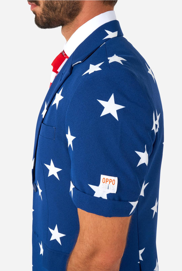 Man wearing American flag themed Summer suit, side view