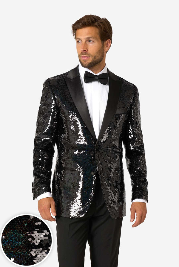 Man wearing a black sequin jacket with a close-up of the sequins on a white background
