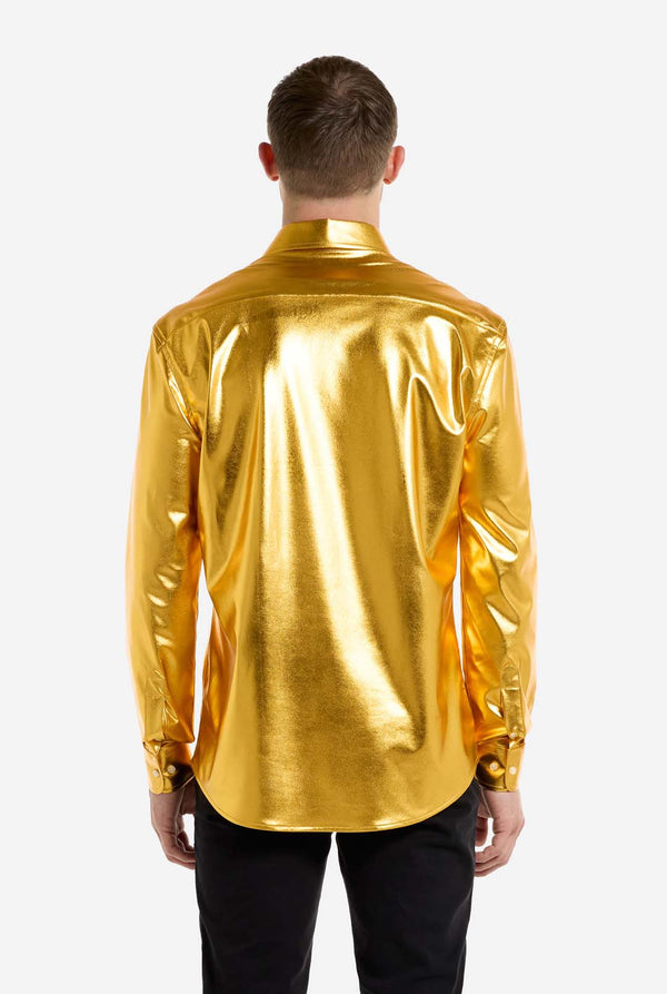 Person wearing a shiny gold shirt on a white background, view from the back.