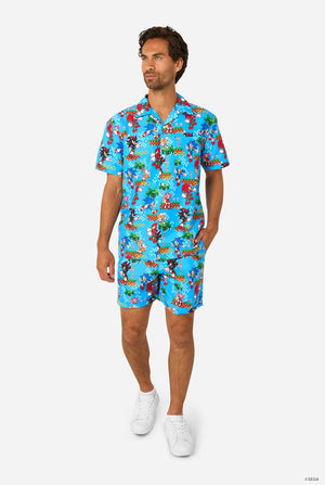 Image of a man wearing a blue summer set with Sonic, Tails, Knuckles, and Shadow game print. Full body image.
