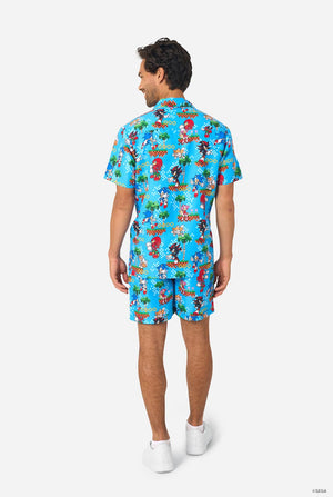 Image of a man wearing a blue summer set with Sonic, Tails, Knuckles, and Shadow game print. View from the back.