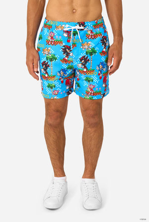 Image of a man wearing a blue summer set with Sonic, Tails, Knuckles, and Shadow game print. Shorts close-up.