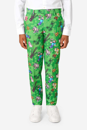 A teen boy wearing a bright green Minecraft suit with iconic characters, including Creepers and Steve - Close up of the pants