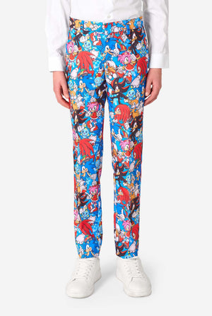 Teen boy wearing a vibrant Sonic teen suit featuring colorful prints of Sonic the Hedgehog characters including Sonic, Knuckles, Tails, and Amy, paired with a matching tie and white shirt. Close up pants.