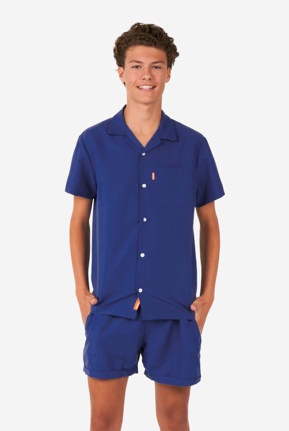  Teen wearing dark blue summer set, consisting of shorts and shirt
