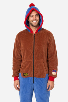 Male model wearing a brown and blue South Park Stan adult onesie with blue and red hood.