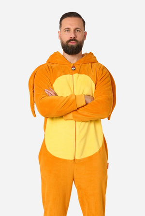 A man wearing a plush animal onesie in orange and yellow, standing with arms crossed against a light gray background.