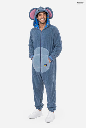 A man wearing a blue elephant onesie costume with pink inner ears, a blue patterned hood lining, and a light blue belly patch, standing against a light gray background.