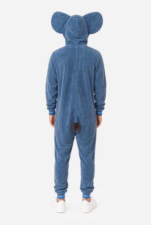 A man wearing a blue elephant onesie pajama with pink inner ears, a full front zipper, and a hood, standing against a white background. View from the back.