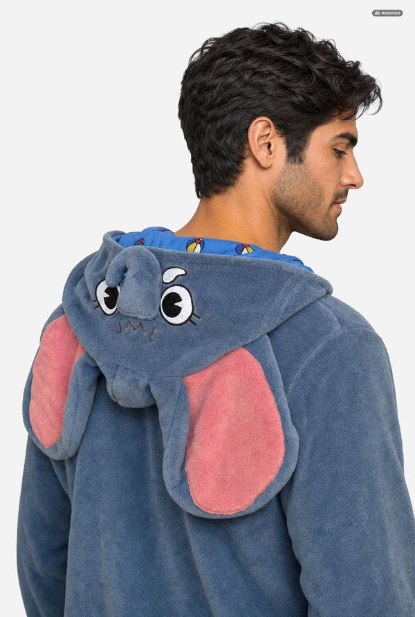 A man wearing a plush blue elephant-themed hooded sweatshirt, shown from the back and side profile against a plain light gray background.