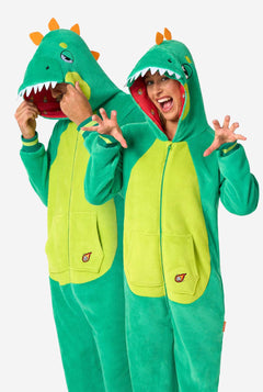 Two people wearing green dinosaur onesies on a white background