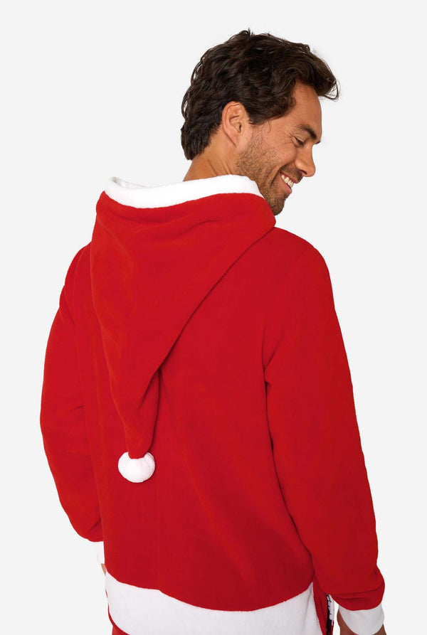 A smiling man models a cozy, red and white, hooded christmas onesie that resembles a Santa onesie. Close up of the back