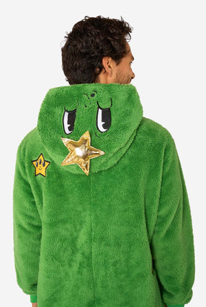 A smiling man wearing a green Christmas onesie designed to look like a Christmas tree, decorated with cartoon ornaments and stars. Close up of the hood