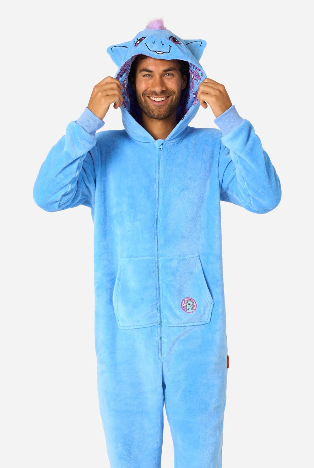 Man wearing a blue My Little Pony onesie with a hood on a light background.