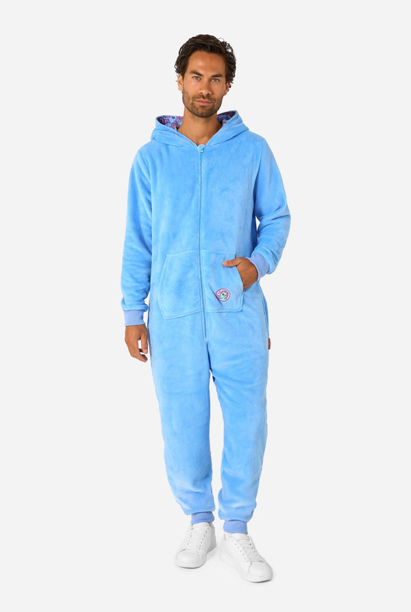 Man wearing a blue My Little Pony onesie with a hood on a light background. Full body image with the hood down.
