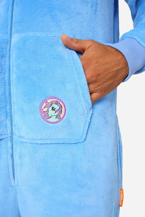 Man wearing a blue My Little Pony onesie with a hood on a light background. Pocket close up.