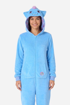 Woman wearing a blue My Little Pony onesie with a hood on a light background.