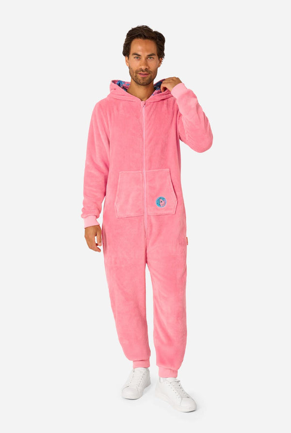 Man wearing a pink onesie with a My Little Pony design on a light background. Full body image with the hood down.