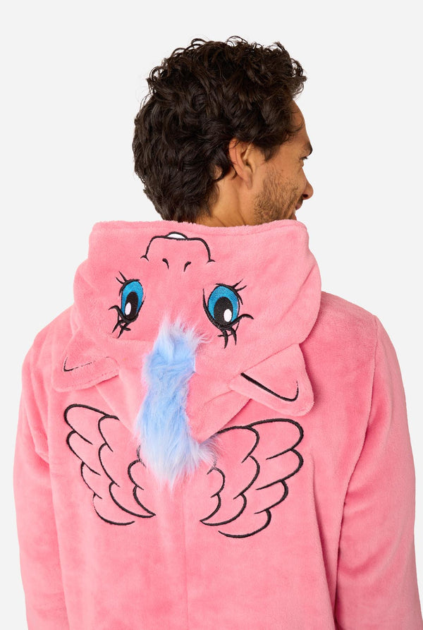 Man wearing a pink onesie with a My Little Pony design on a light background. View from the back, hood close up