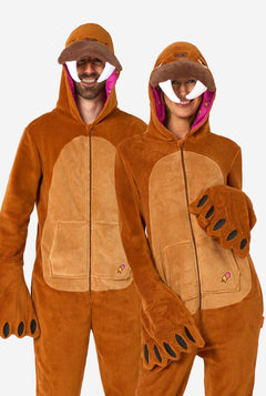Two people wearing brown walrus onesies on a white background