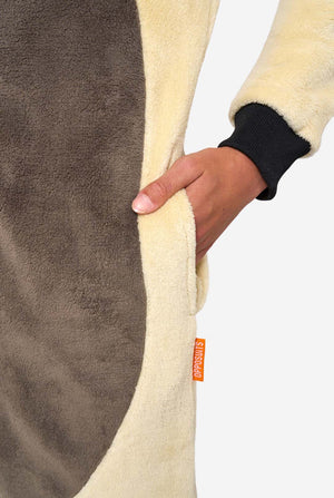 Child wearing a cartoon character Appa onesie hoodie with a white background. Close up of the pockets