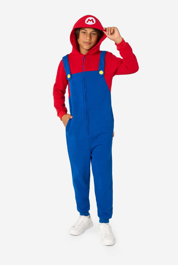 Person wearing a red and blue Mario jumpsuit with a hood on a white background