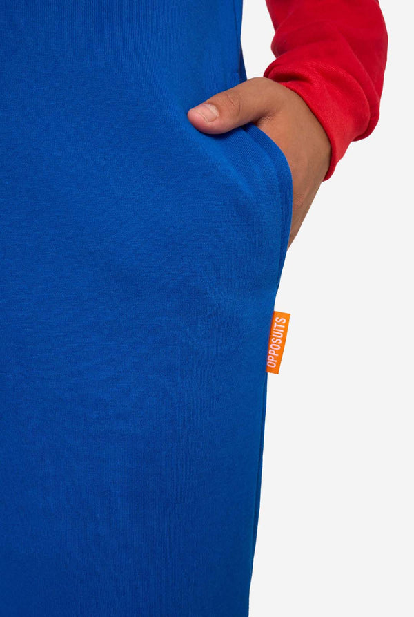 Close-up of a blue garment with an orange tag on a white background