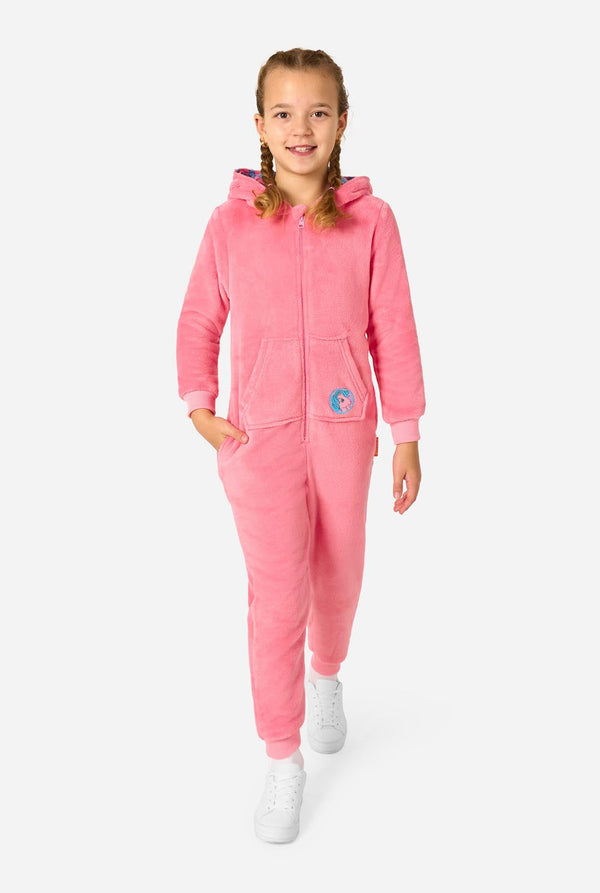 Child wearing a pink onesie resembling a My Little Pony on a light background. Full body image with the hood down.