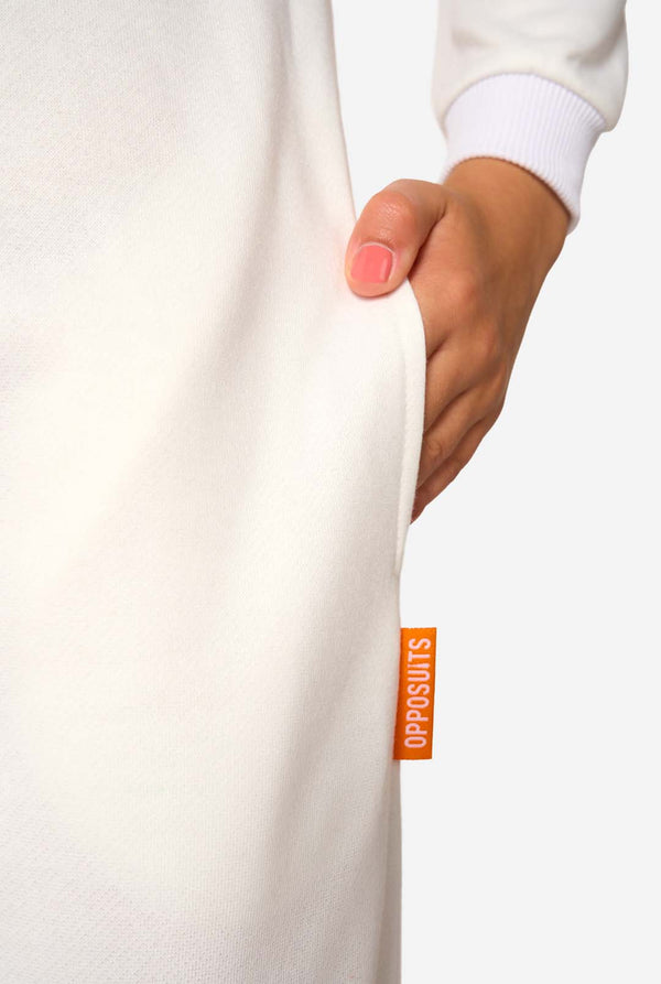 Close-up of a child’s hand in the white side pocket of the Sandy Cheeks onesie, with an orange OppoSuits label.