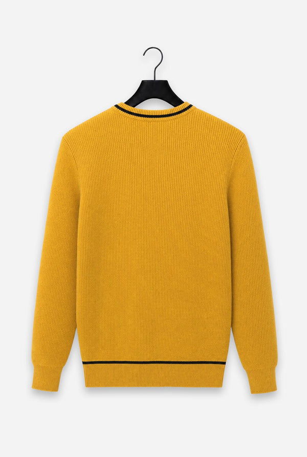 A mustard yellow ribbed knit sweater with black trim at the crew neck and hem, hanging on a black hanger against a light gray background.