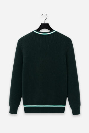 A dark forest green ribbed knit sweater with contrasting light green and white trim at the crew neck and hem, hanging on a black hanger against a light gray background.
