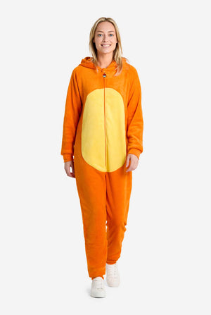 Woman wearing an orange and yellow Charmander onesie on a white background.