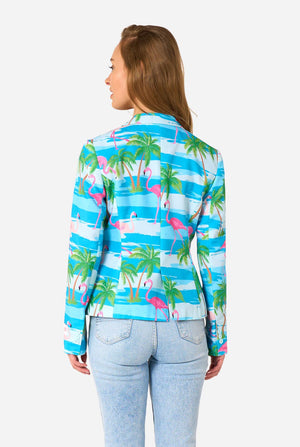 Image with a light background and a woman wearing a light blue blazer with tropical flamingo print and jeans. View from the back.