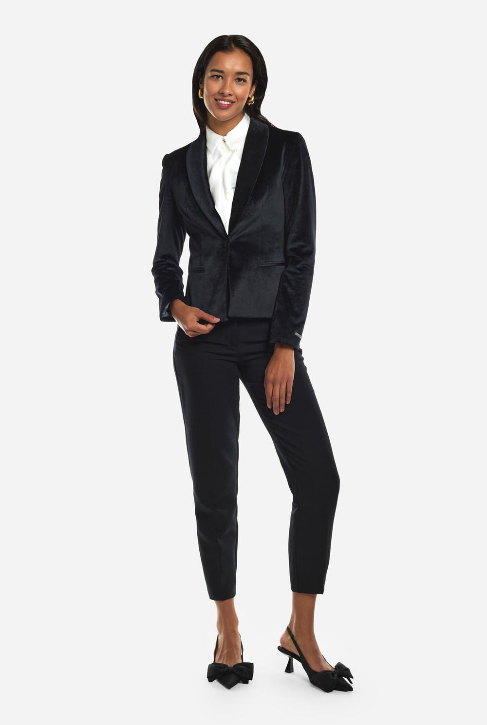 Woman wearing black velvet dinner jacket blazer