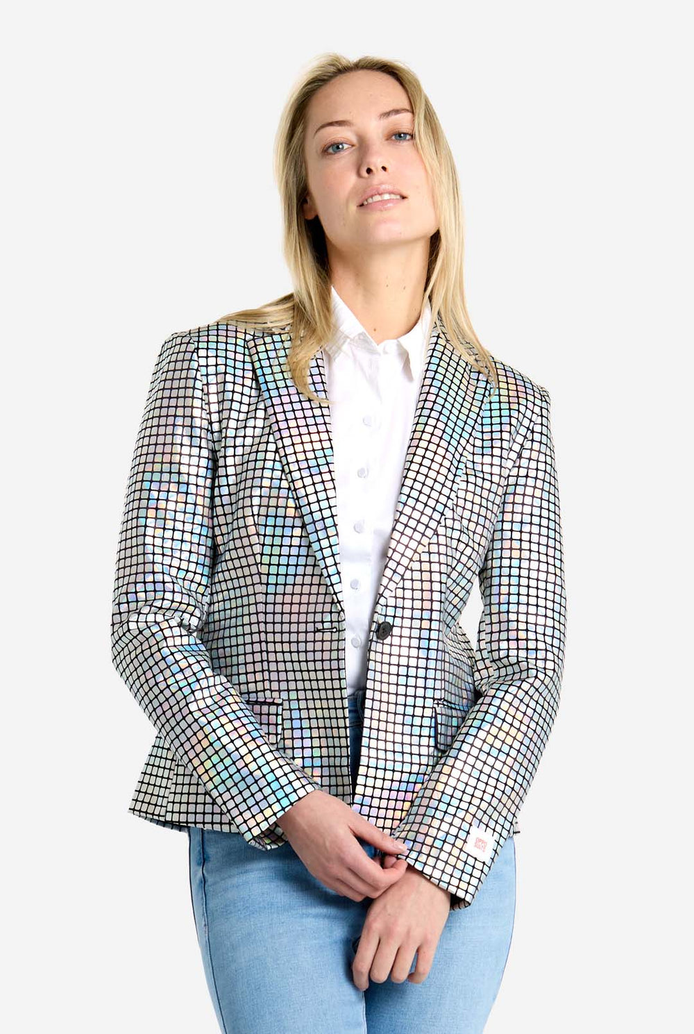 Woman wearing a checkered discoball like blazer over a white shirt with a plain background