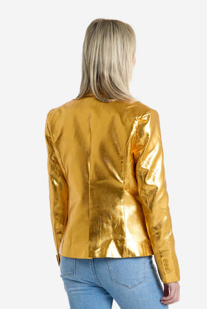 Person wearing a gold metallic jacket on a white background