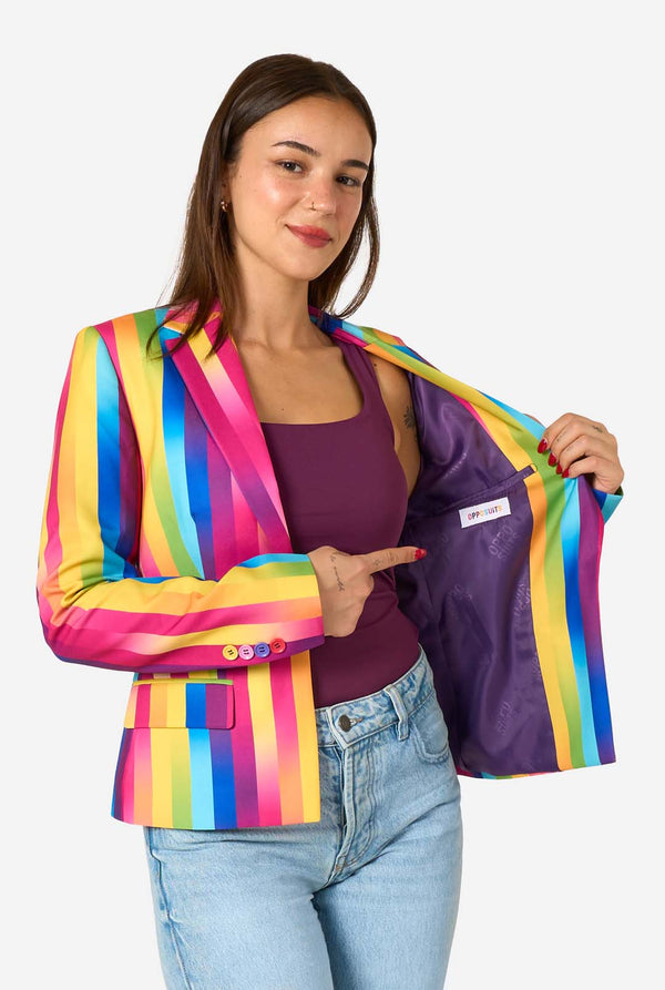 Woman wearing a colorful striped blazer with a visible brand logo on a white background.