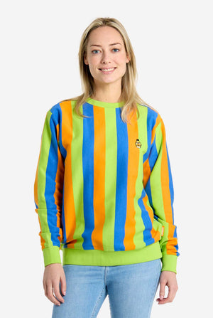 A woman wearing a colorful striped Sesame Street Bert sweater with a plain background