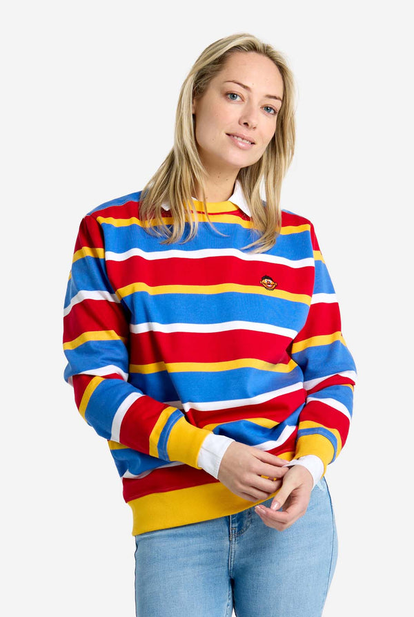 Woman wearing a colorful striped sweater on a white background