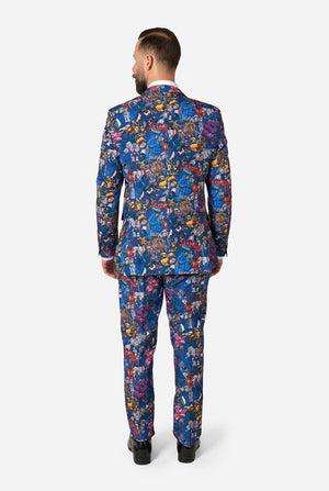Man wearing a colorful suit with Transformer pattern on a light background. View from the back.