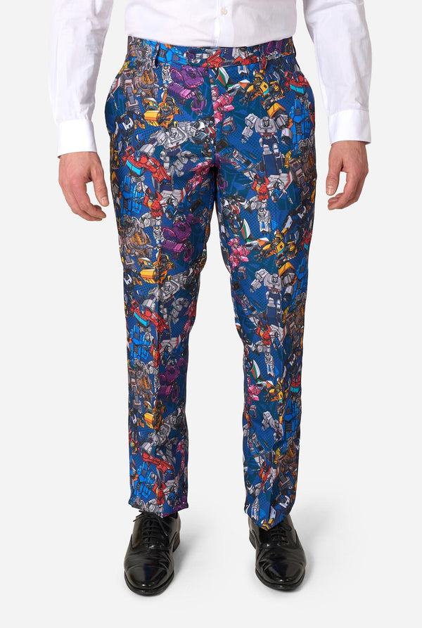 Man wearing a colorful suit with Transformer pattern on a light background. Pants close up.