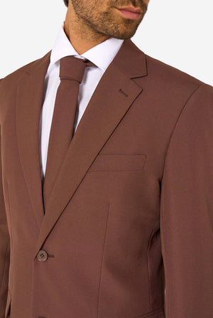Close-up of the upper chest area of a brown suit jacket with notched lapel, white shirt, and matching brown tie.