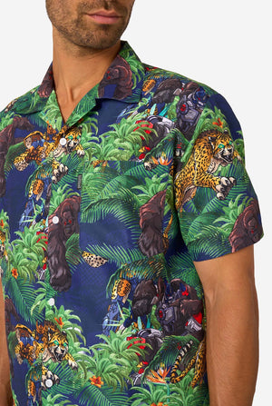 Man wearing a colorful tropical Transformers animal print summer set on a light background. Chest close-up.